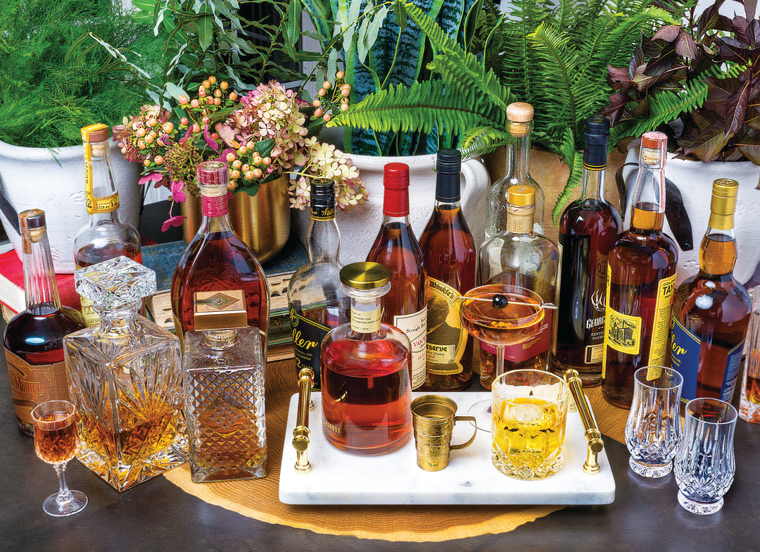 Aether puzzle depicting a scene with multiple bottles of bourbon whiskey, ornate glassware, and a floral arrangement, evoking the artistry of fine spirits.
