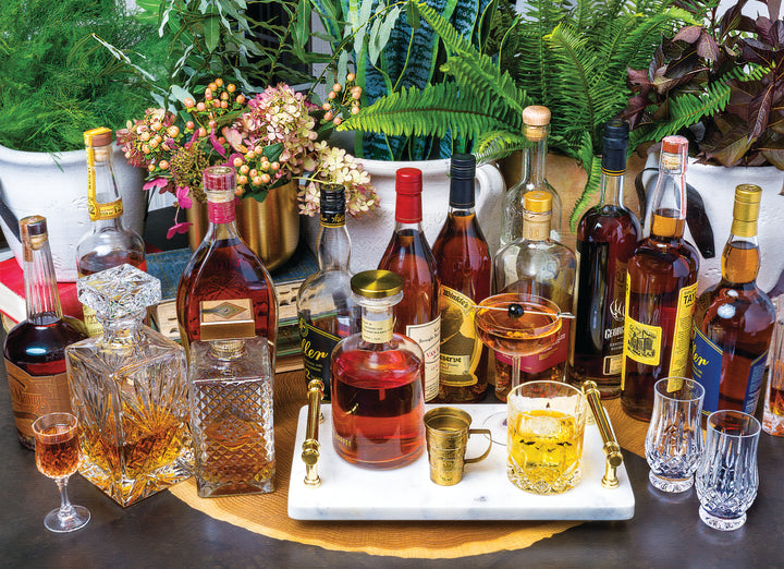 Aether puzzle depicting a scene with multiple bottles of bourbon whiskey, ornate glassware, and a floral arrangement, evoking the artistry of fine spirits.