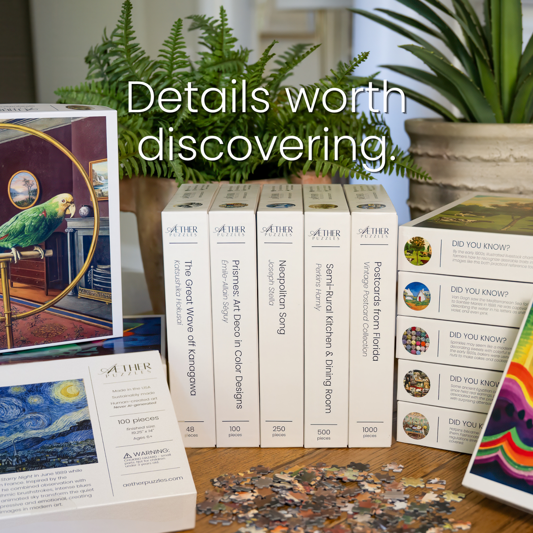 A collection of A+HR jigsaw puzzle boxes and loose puzzle pieces arranged on a tabletop, with large overlaid text reading &